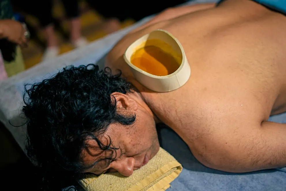 Kati Basti oil therapy during the daily Ayurveda routine at VYA Bali