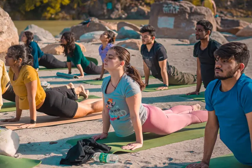 Beach yoga outdoor session by the sea