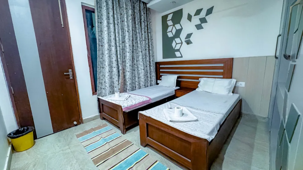 Twin beds in a two-sharing room at Vinyasa Yoga Academy Rishikesh