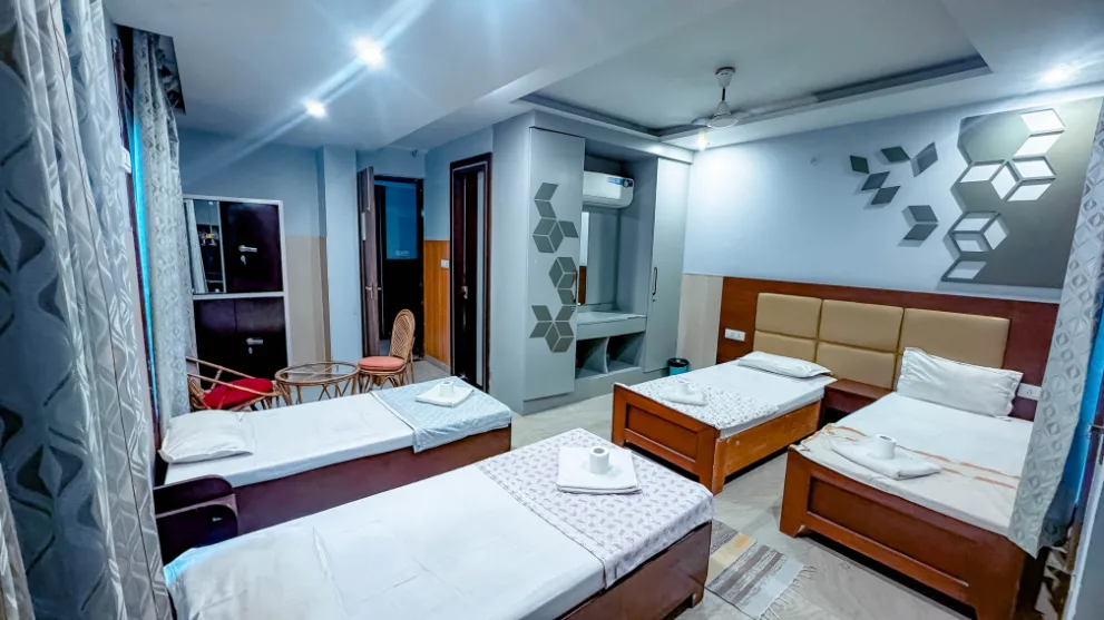 Four-bed shared room interior at the Rishikesh yoga school