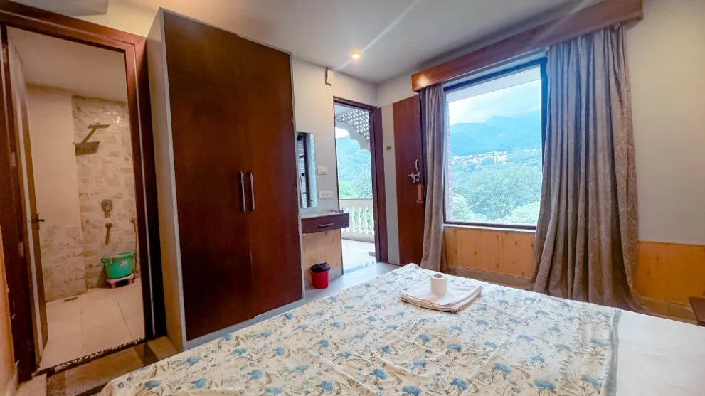 Private room with attached bathroom and valley view at Vinyasa Yoga Academy Rishikesh