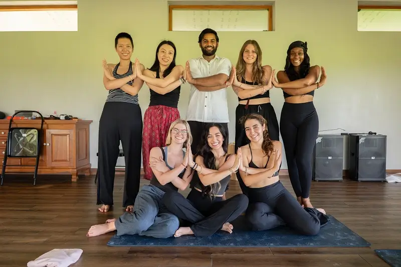 Yoga teacher training students together in the shala