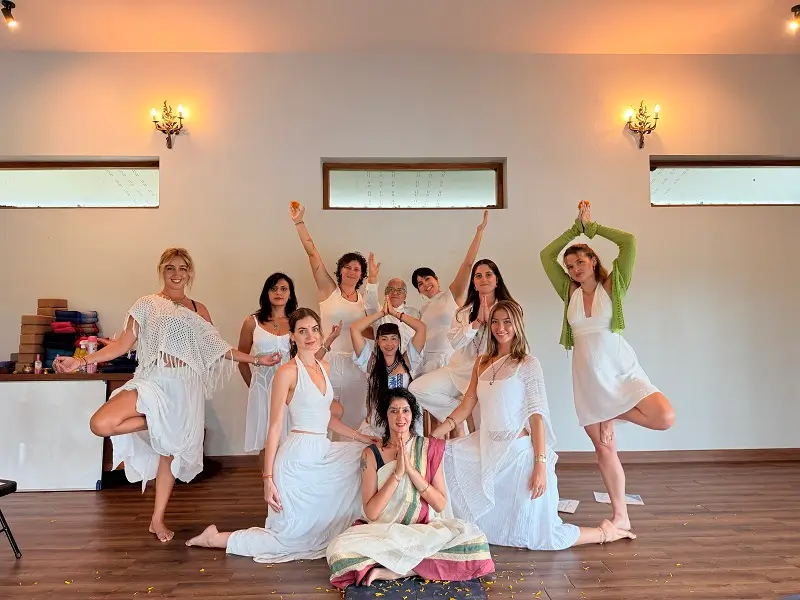 Students practising together in the yoga hall