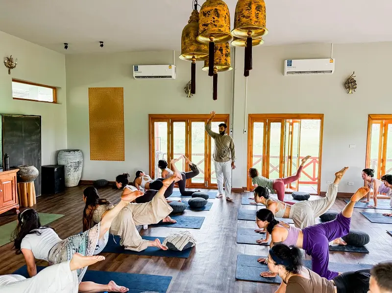 Group asana class in the shala at the Chiang Mai campus