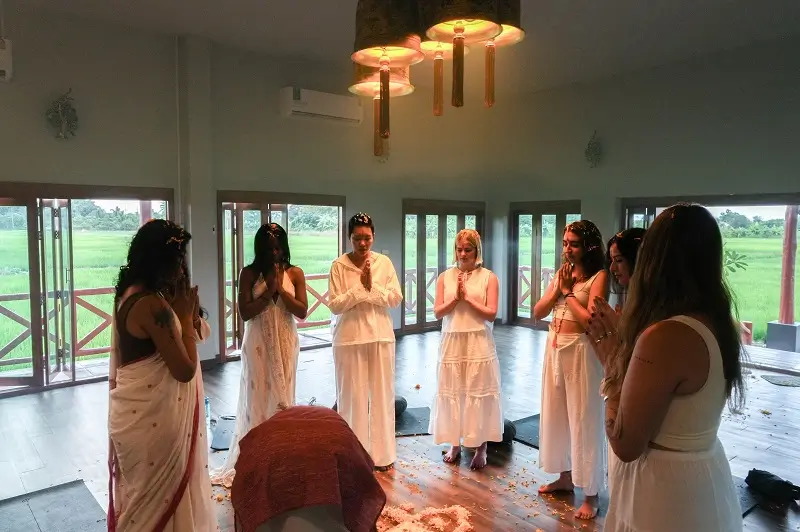 Closing ceremony in the hall, hands at the heart