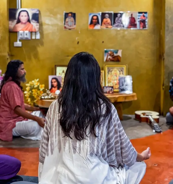 Sitting in front of the altar in the meditation hall