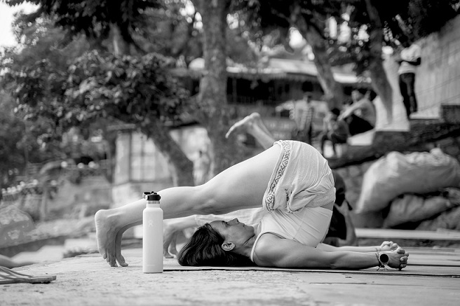 Student Performing Halasana (Plow Pose) During 200 Hour Yoga Teacher Training in Rishikesh