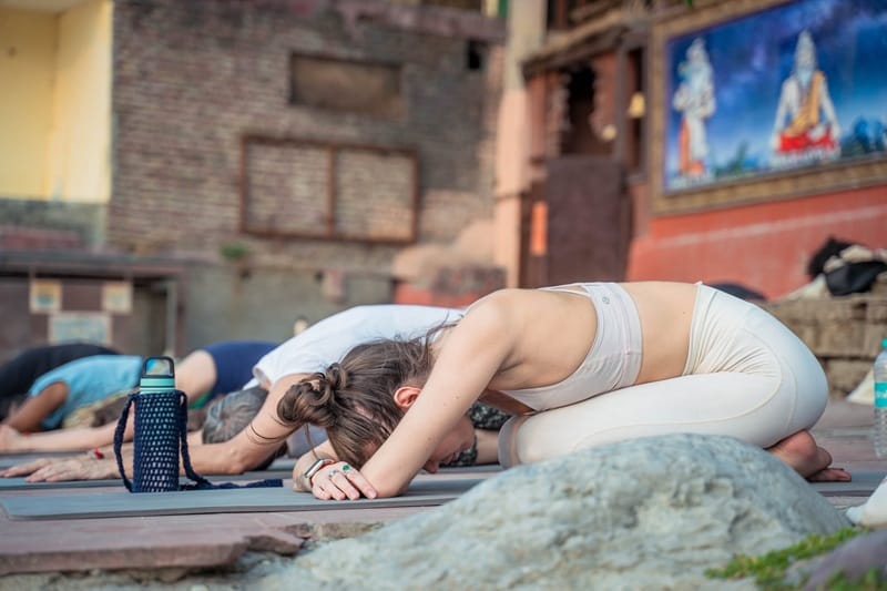 Woman practicing Child’s Pose (Balasana)