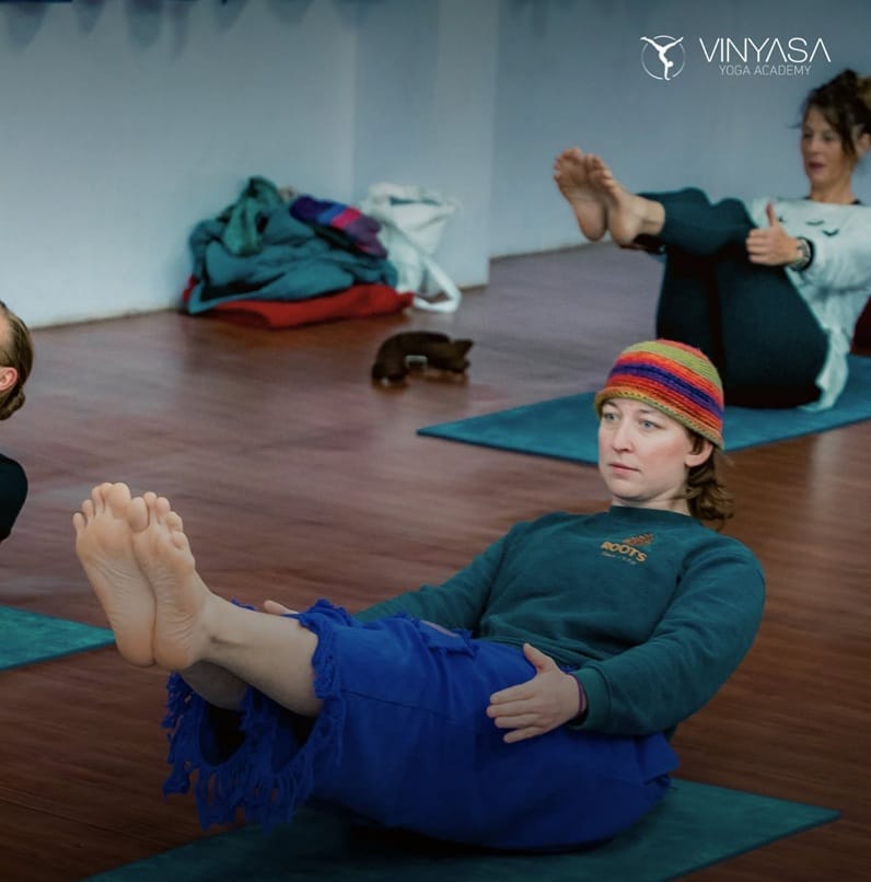 Woman Practicing Boat Pose