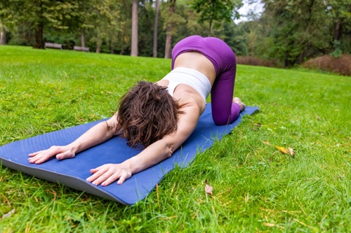A Woman Doing Extended Puppy Pose A Woman Doing Extended Puppy Pose