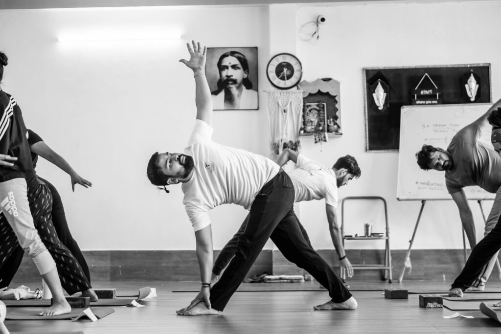 Student Practising Trikonasana (Triangle Pose) During 200 hour Yoga TTC