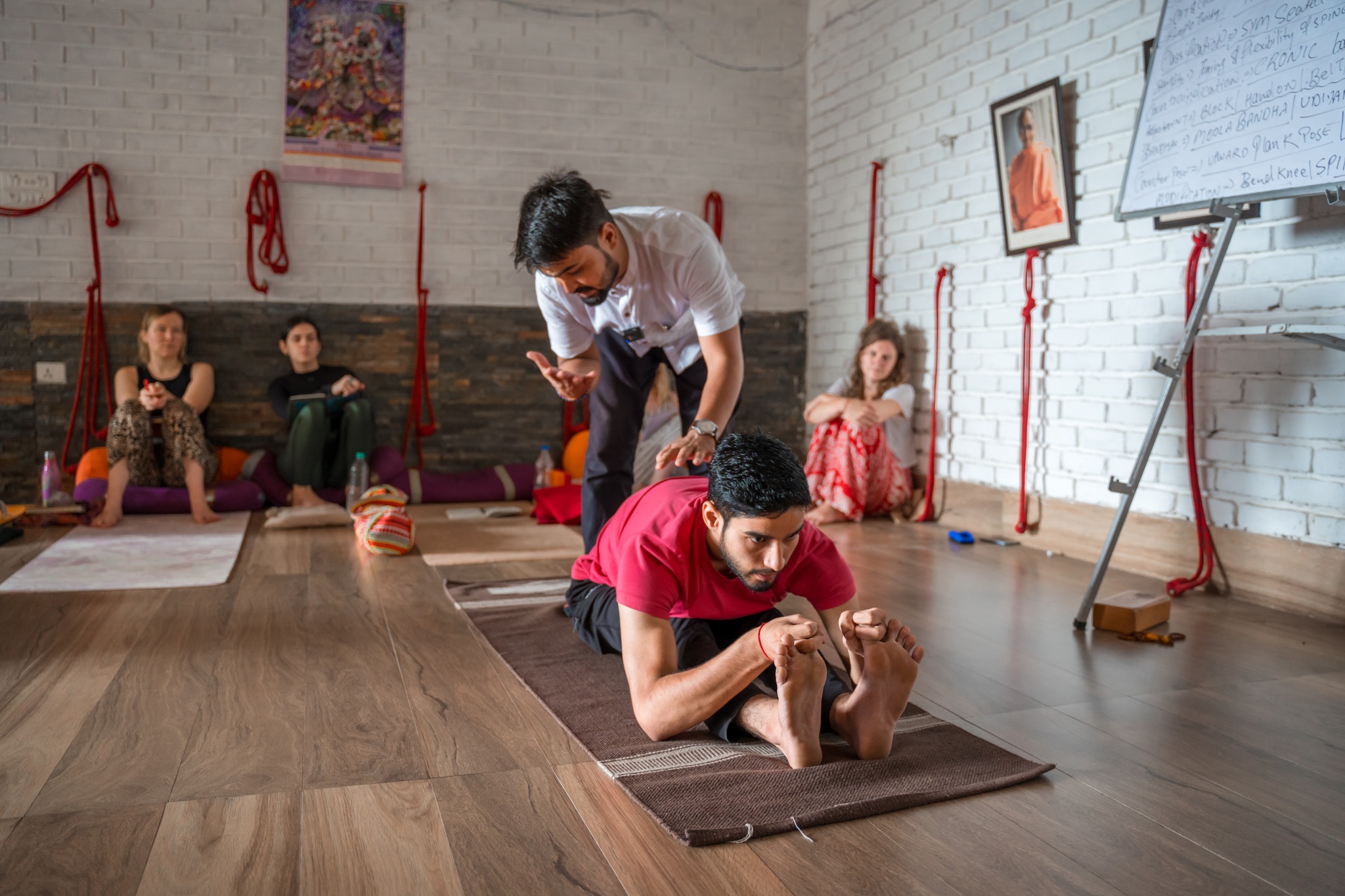 Student Practising Paschimottanasana During TTC at Vinyasa Yoga Academy