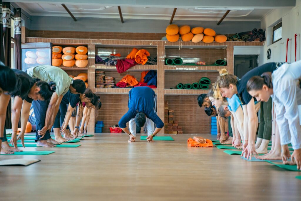 Student Practising Uttanasana (Standing Forward Fold) During 200 hour Yoga TTC
