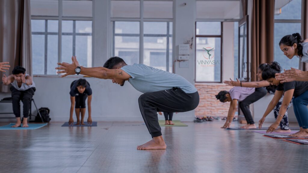 Student Practising Chair Pose During 200 Hour YTTC at Vinyasa Yoga Academy