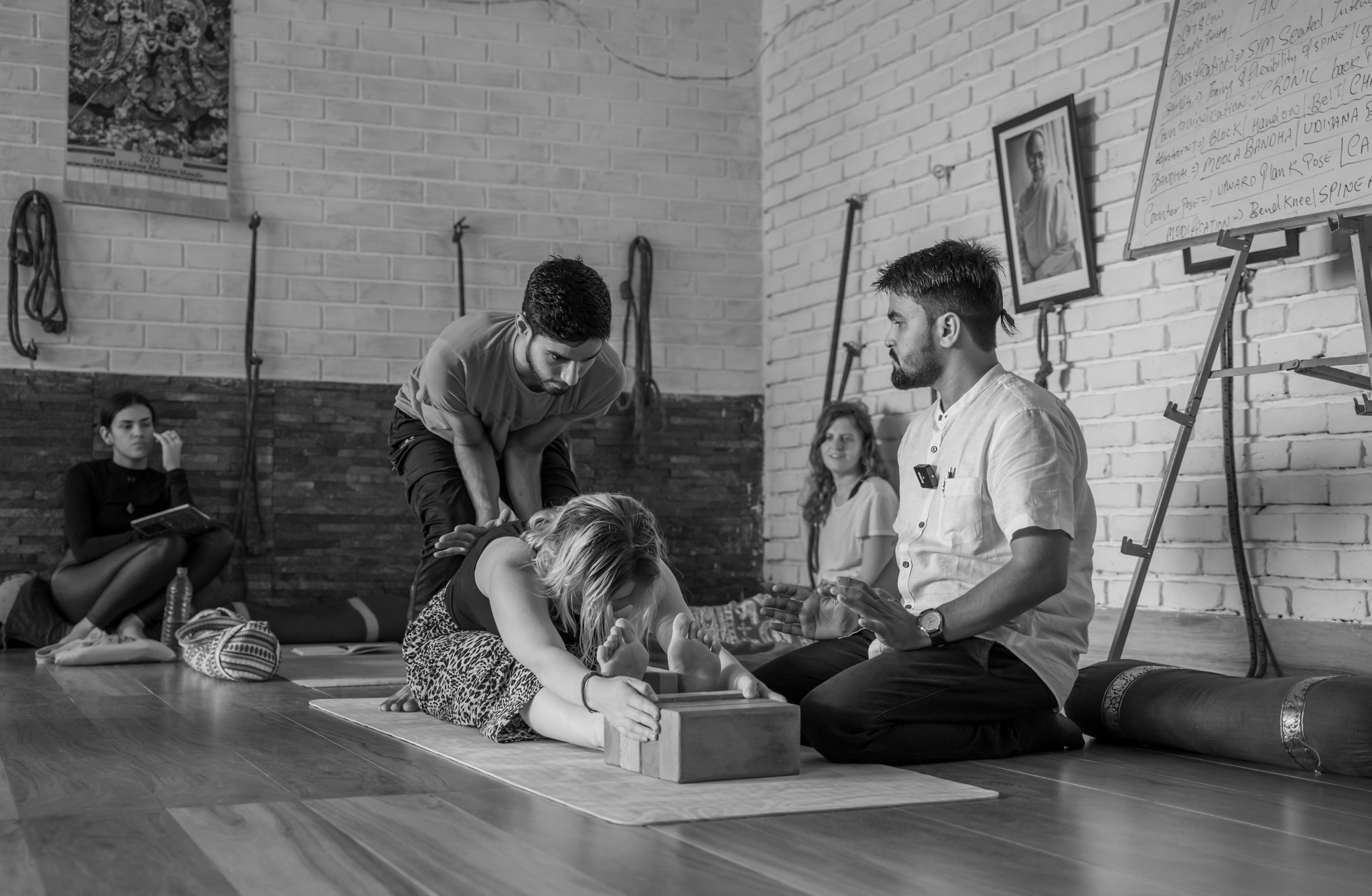 Student Performing Seated Forward Fold (Paschimottanasana) During Yoga Teacher Training at Vinyasa Yoga Academy