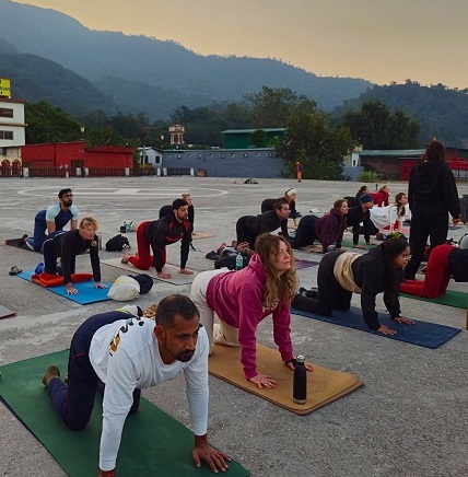 Student Performing Cat-Cow Flow During Yoga Teacher Training at Vinyasa Yoga Academy