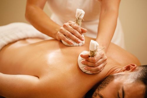 Traditional Panchakarma Massage with Herbal Bundles