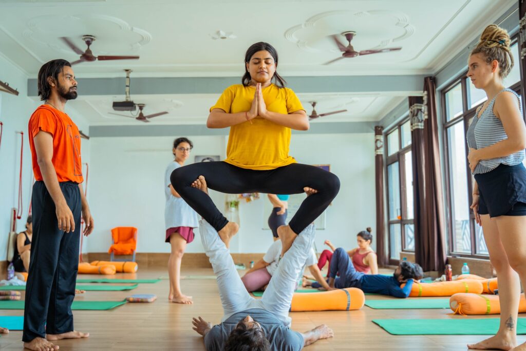 Student Performing Acro Yoga During 300 Hour Yoga Teacher Training at Vinyasa Yoga Academy